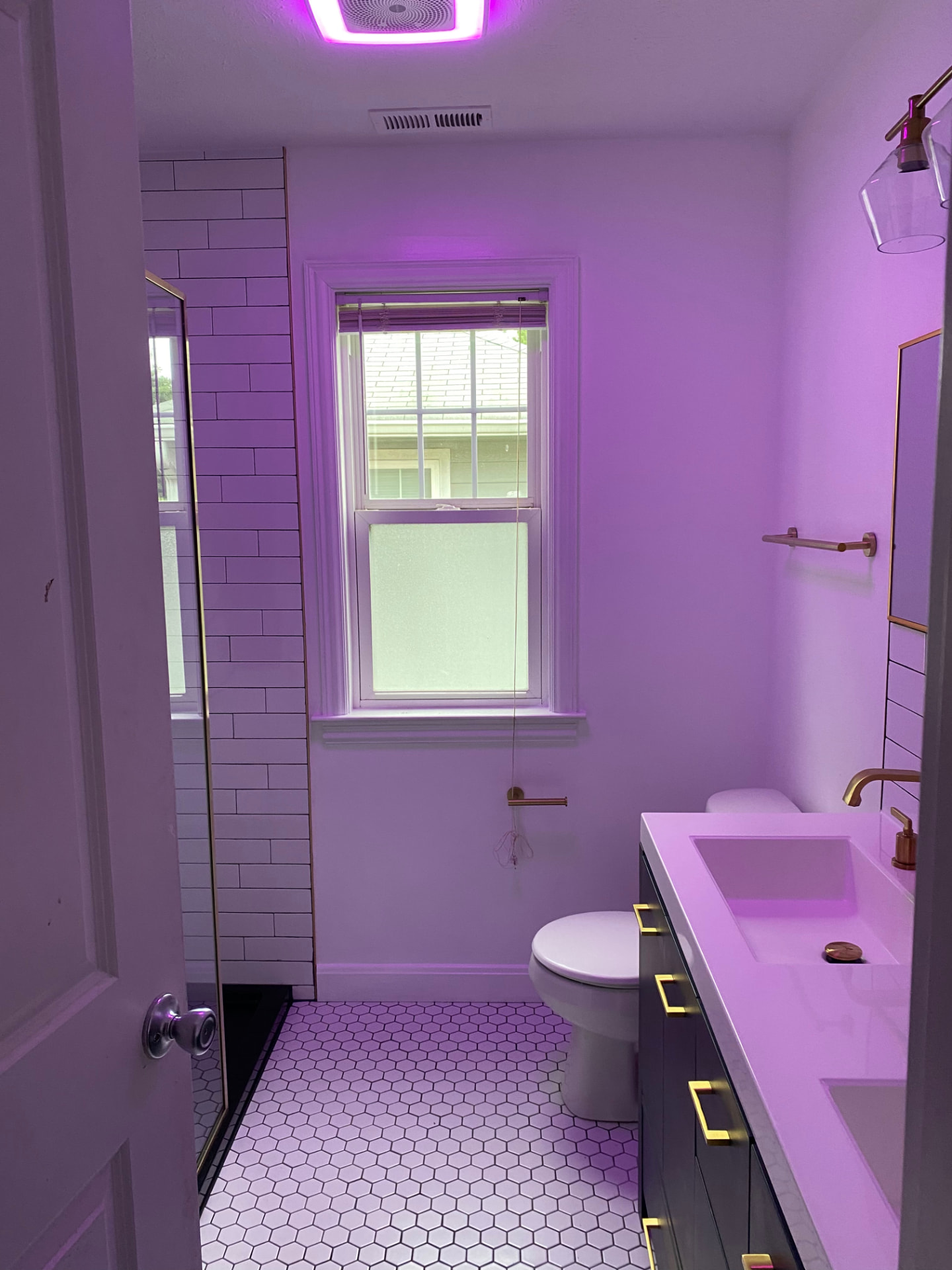 Completed bathroom remodel in an Indianapolis home with large-format tile and matte black fixtures